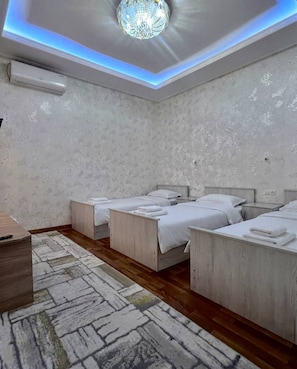 Deluxe Triple Room, Garden View | Laptop workspace, iron/ironing board, free WiFi - Aisha Guest House (Samarkand)