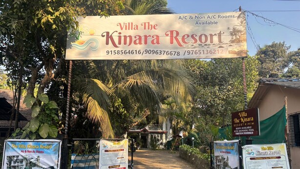 The entrance to Villa The Kinara Resort with a signboard displaying contact information and amenities. - Villa The Kinara Resort (Kihim)
