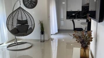 Apartment (Two Bedroom Apartment 1) | Living room | 32-inch flat-screen TV with cable channels