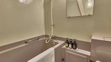 Combined shower/tub, hair dryer, slippers, towels