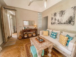 Deluxe Villa, Patio, Pool View | Living area