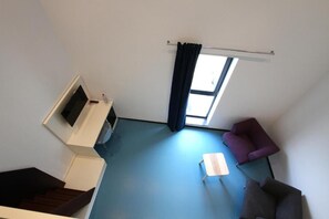 Habitación con 1 cama matrimonial o 2 individuales, para no fumadores | Área de sala de estar