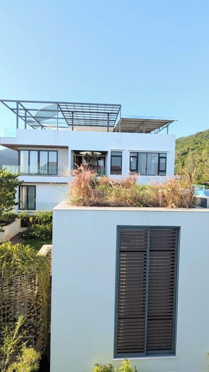 A modern two-story building with large windows and a flat roof. - AN Apartment (Son Tra)