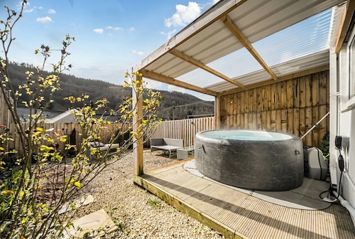 Valley views, hot tub and pool table — sleeps 8 in the Welsh hills