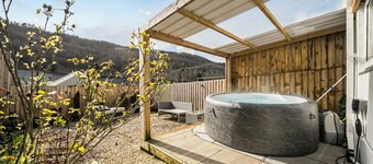 Valley views, hot tub and pool table — sleeps 8 in the Welsh hills