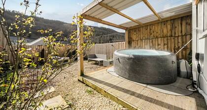 Valley views, hot tub and pool table — sleeps 8 in the Welsh hills