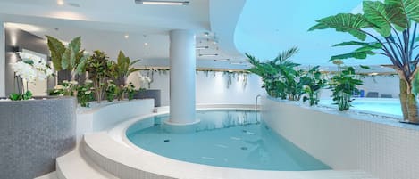 Indoor pool, open 8:00 AM to 10:00 PM, pool loungers