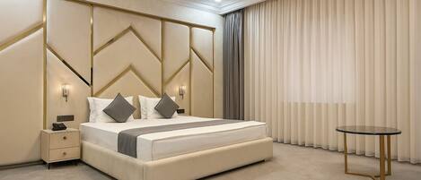 Luxury Suite, City View | In-room safe, desk, laptop workspace, blackout drapes