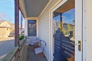 Exterior detail - Escape to harbor bliss in this private cottage unit in Newport's Yachting Village!  Complete with kitchen, private deck with water views, mini-split AC, TV, Wifi and off-street parking. Steps to harbor, Thames Street, restaurants - Relax & Enjoy! (Newport)