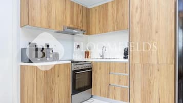 Leilighet, balkong, byutsikt | Eget kjøkken