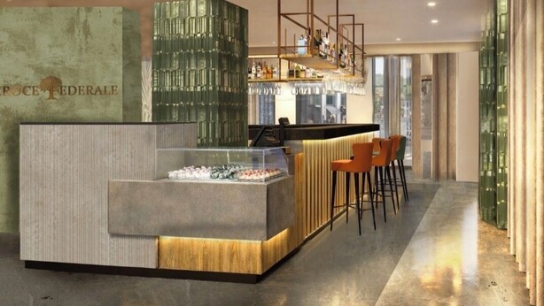 A modern bar area with a glass display case, wooden stools, and a bar counter.