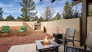An outdoor patio with a fire pit, seating, and a pergola structure. - Sedona Getaway Sedona! 2-King, Hiking, Views, Pets! (Sedona)