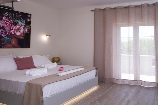 Modern Minimalist Bedroom with Natural Daylight and Clean White Interior Design