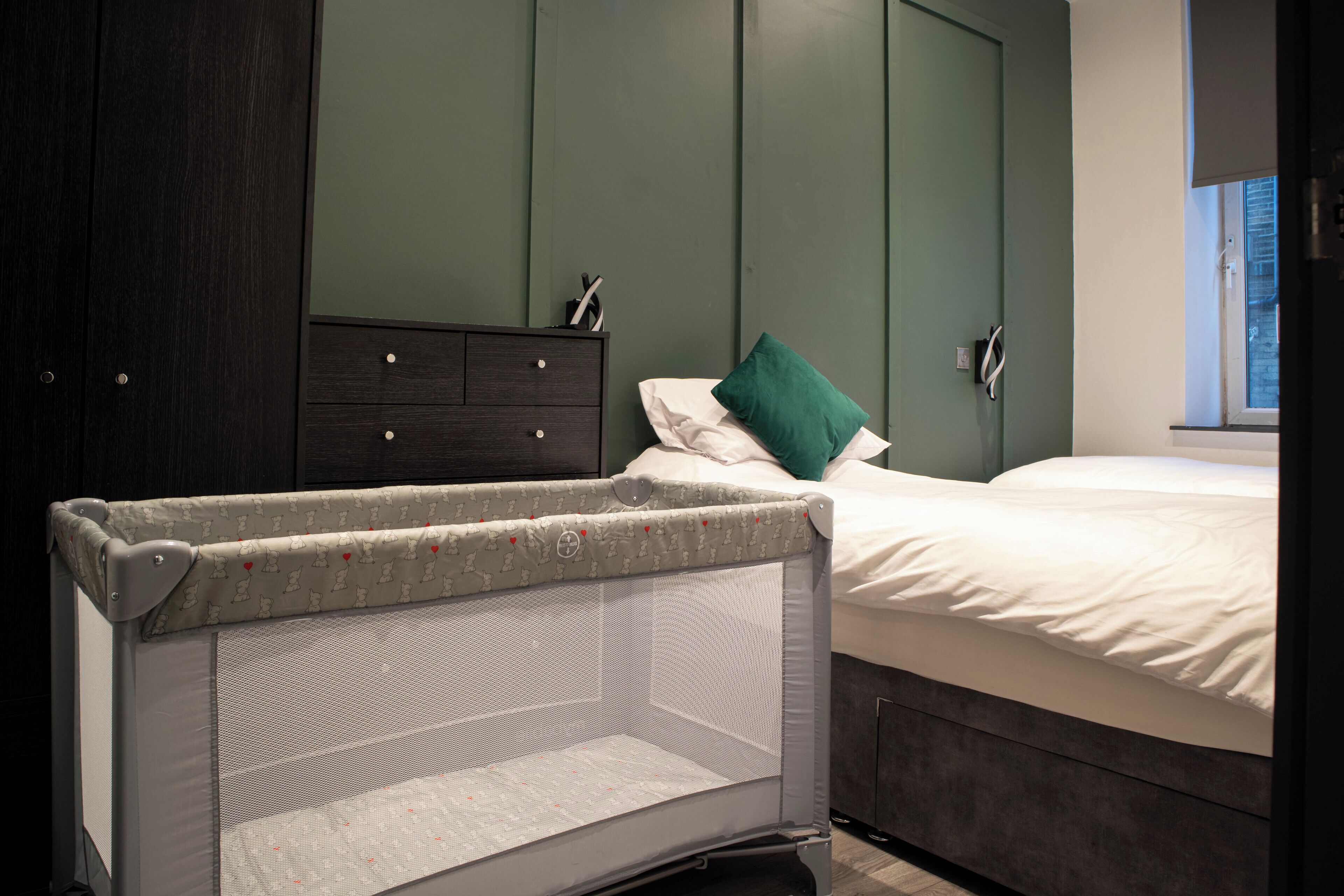 1 bedroom, desk, iron/ironing board, travel cot