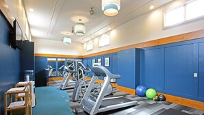 A gym with treadmills, exercise balls, and a water dispenser. - Lakeview At The Lodge Two Bedroom Suite (Two Harbors)