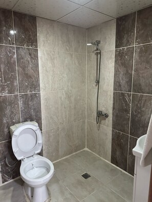 Shower, hair dryer, slippers, towels