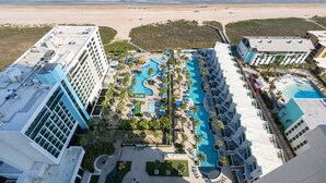 A resort with multiple swimming pools, a beach, and high-rise buildings. - Sapphire - Just a Dream - 26th Floor Luxury (South Padre Island)