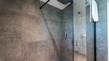 Shower, hair dryer, towels, toilet paper