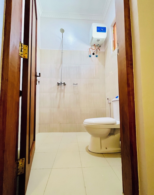 Shower, towels, soap, toilet paper