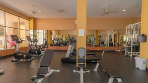 A gym with treadmills, weight machines, and benches. - Sonoran Spa N 501 1 Bed 1 Bath (Puerto Peñasco)