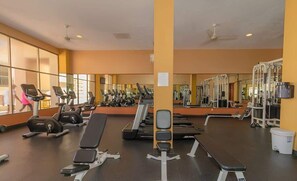 A gym with treadmills, weight machines, and benches. - Sonoran Spa N 501 1 Bed 1 Bath (Puerto Peñasco)