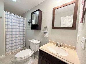 Shower, hair dryer, towels, shampoo