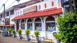 A building with signs for 'Cara Galle Fort,' 'Cara Jewellers,' and 'Cara Bike Rent.' - Cara Galle Fort (Galle)