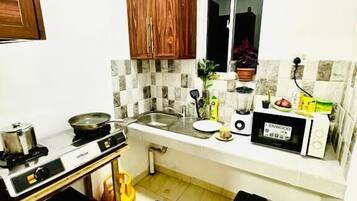 Chambre Deluxe double, vue sur la ville | Cuisine privée