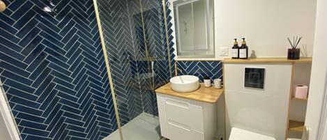 Shower, hair dryer, towels, soap