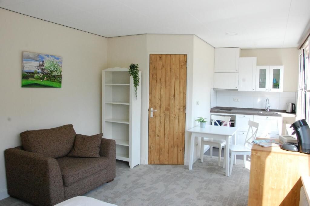 Studio – deluxe, byutsikt | Oppholdsområde