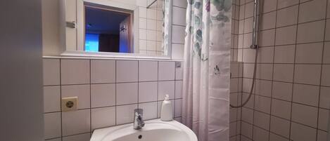 Shower, towels, soap, toilet paper
