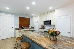 Fridge, microwave, oven, coffee/tea maker - Pacifico L505 • 2 BR Ground-Floor Resort-Club Condo with Direct Pool Access (Playas del Coco)