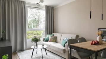 Apartamento, 1 cama Queen e sofá-cama | Área de estar