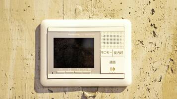 A Panasonic electronic device mounted on a wall.