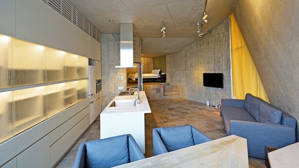 A modern kitchen with a built-in stove, a sink, and a dining area with blue chairs. - 【Free pickup for over 4 nights stay】Center of the Tokyo Luxury 4-storey Villa (Minato City)