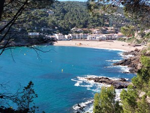 A coastal town with a beach, houses, and rocky coastline. - Villa 'Brun' with Sea View, Private Pool and Wi-Fi (Sa Riera)