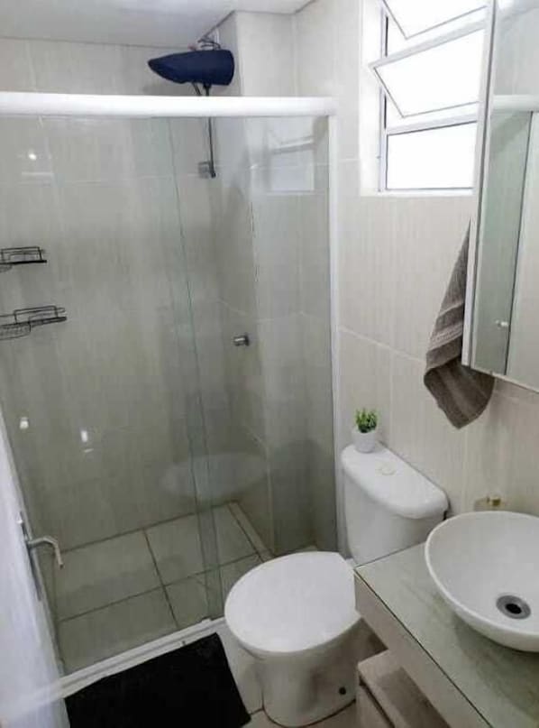 Shower, hair dryer, towels, toilet paper