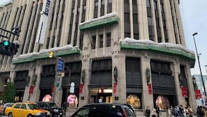A large, historic building with a prominent sign reading "SETAN" and a large circular emblem above the entrance. - Honmachi 2 Chome (Tokyo)