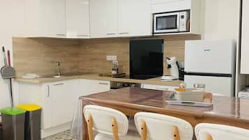 Fridge, microwave, oven, high chair
