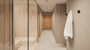 A modern hallway with wooden paneling, a white towel hanging on the wall, and a wooden door at the end. - Boutique Hotel Sončno Polje (Moravske Toplice)