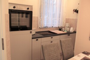Fridge, microwave, stovetop, coffee/tea maker