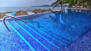 A swimming pool with a clear view of the ocean and beach in the background. - Beachfront Condo + Pool - 2 Bedrooms, 2 king beds, 2 baths, w/ AC - Kite Towers (Nuevo Vallarta)