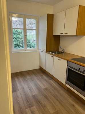 Private kitchen - New, cozy vacation apartment with garden and sunny pool area - top location. (Kaltern)