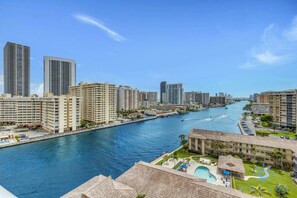 A high-rise hotel with a swimming pool and a marina. - Resort-Style 2BR | Views | Pool & Gym (Hallandale Beach)