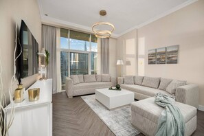 TV, fireplace - Waterfront Escape | Burj & Canal View | Pool+Sauna (Dubai)
