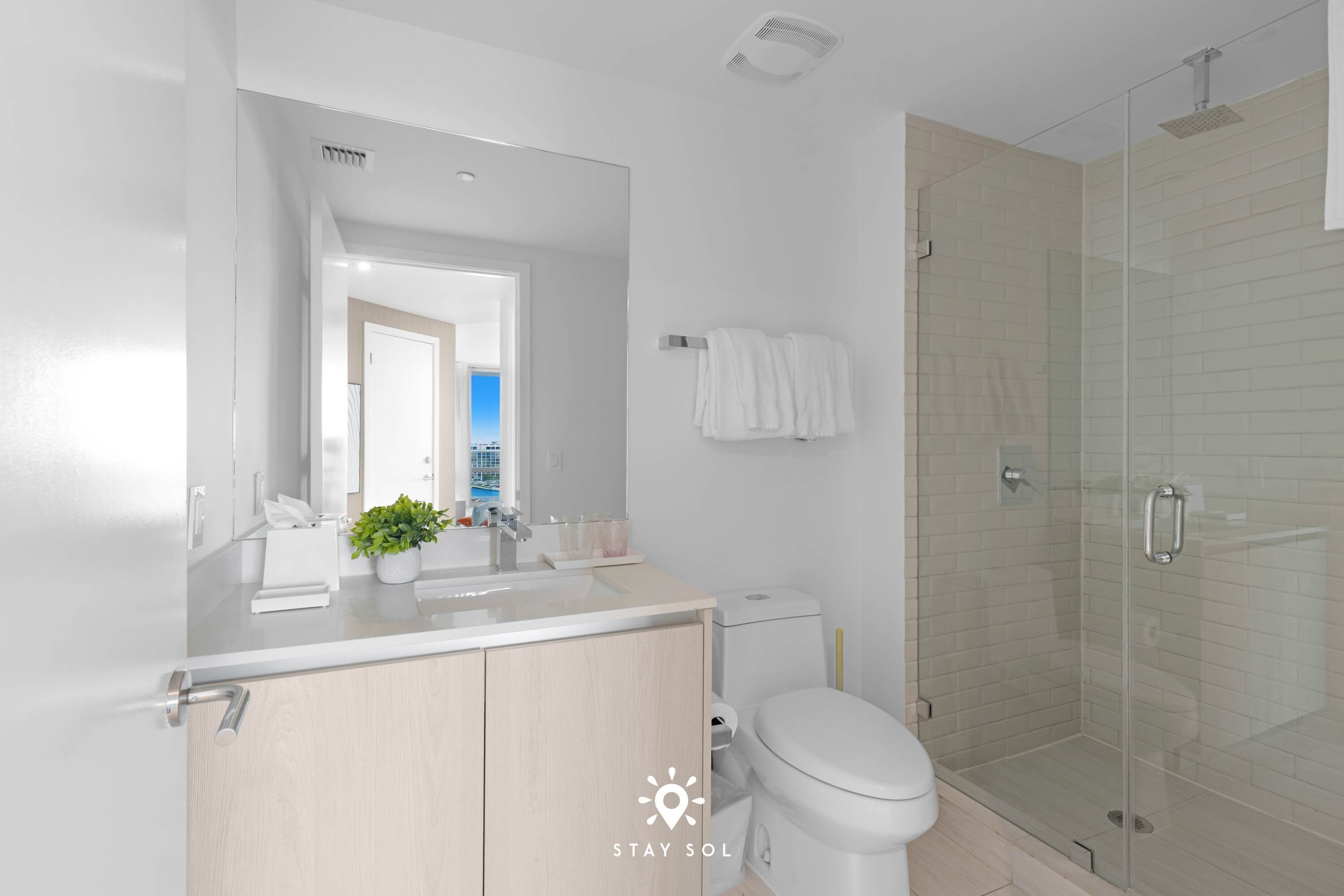 Shower, hair dryer, towels, shampoo
