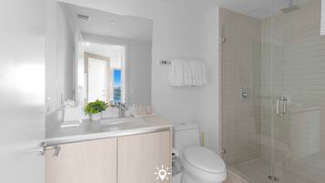 Shower, hair dryer, towels, shampoo