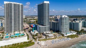 A high-rise hotel complex with multiple buildings, a swimming pool, and a beach area. - Modern Hollywood Beach Escape - City Views (Hollywood)