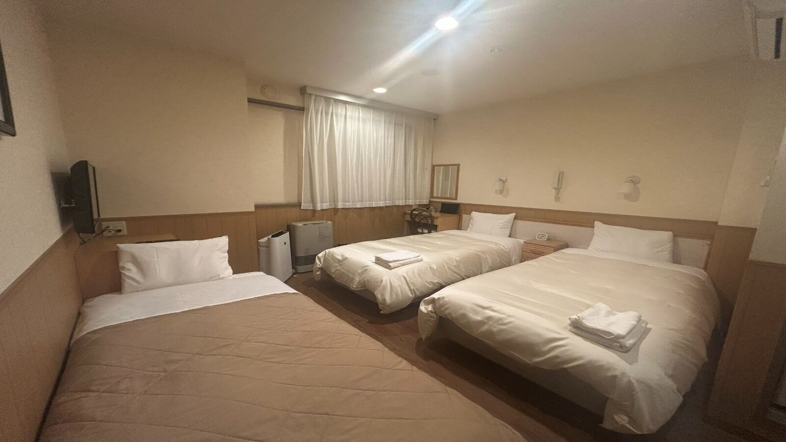 Down comforters, blackout drapes, WiFi (free), bed sheets