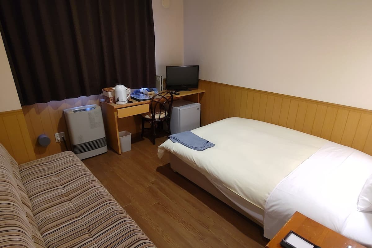 Down comforters, blackout drapes, WiFi (free), bed sheets